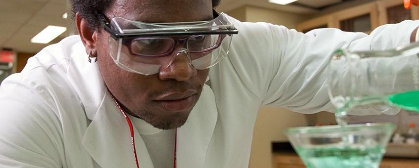 Chemistry student working in a lab.